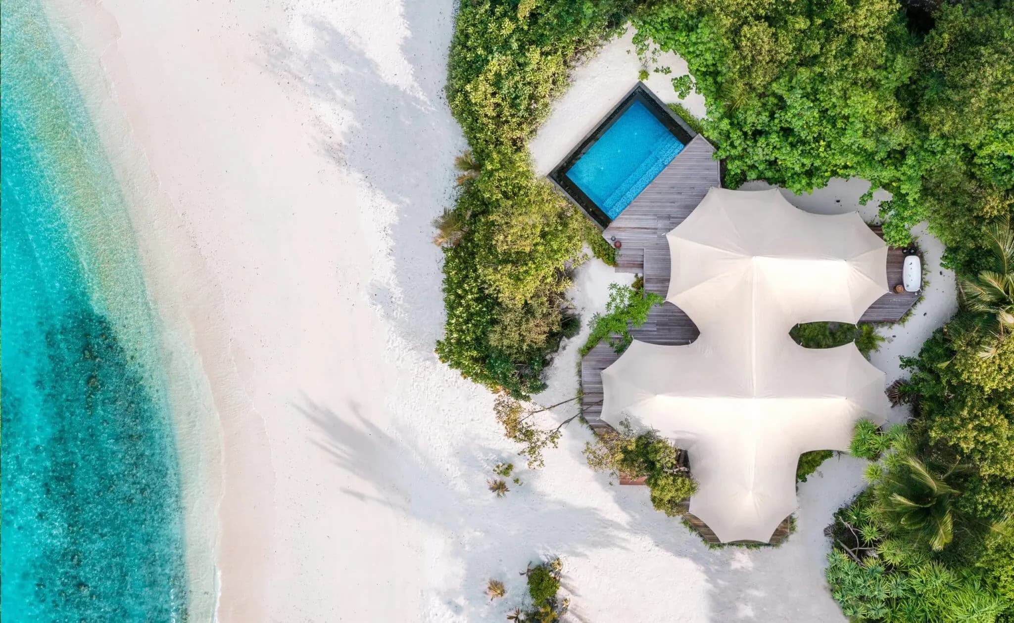 Safari Tented Beach Villa at dusk with private pool at Sirru Fen Fushi