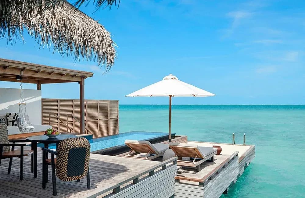 Sunset Grand Water Villa lounge deck over the lagoon at Sirru Fen Fushi