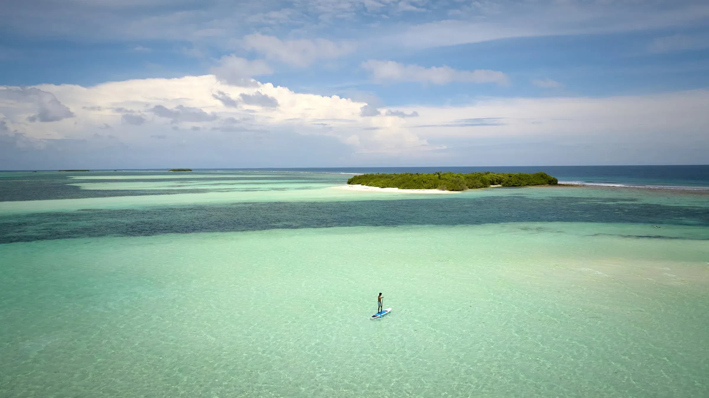 Paddleboarding with the Ocean Watersports team at Six Senses Kanuhura