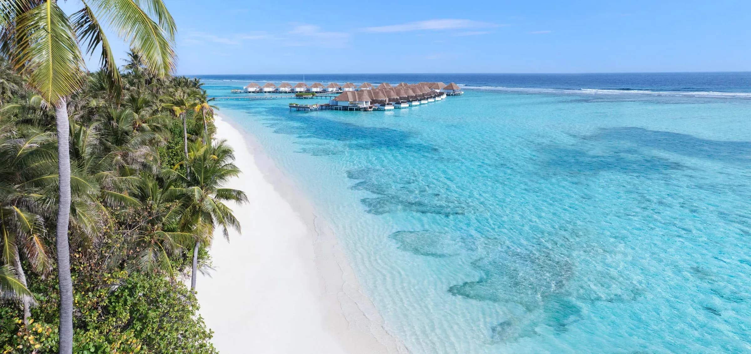 Overwater villas set against the lagoon at Six Senses Kanuhura, Lhaviyani Atoll