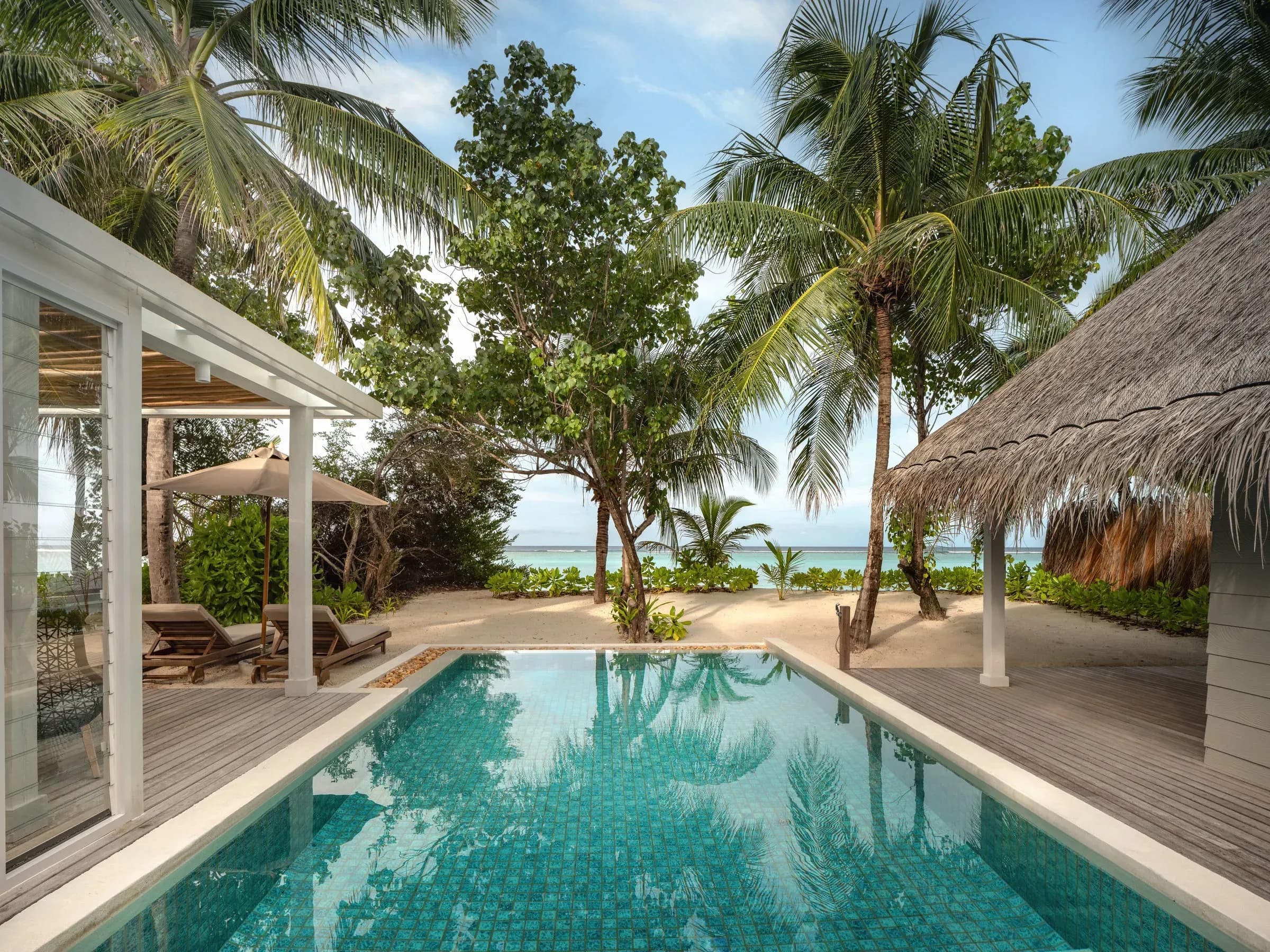 Pool deck of a Deluxe Beach Villa Suite With Pool at Six Senses Kanuhura