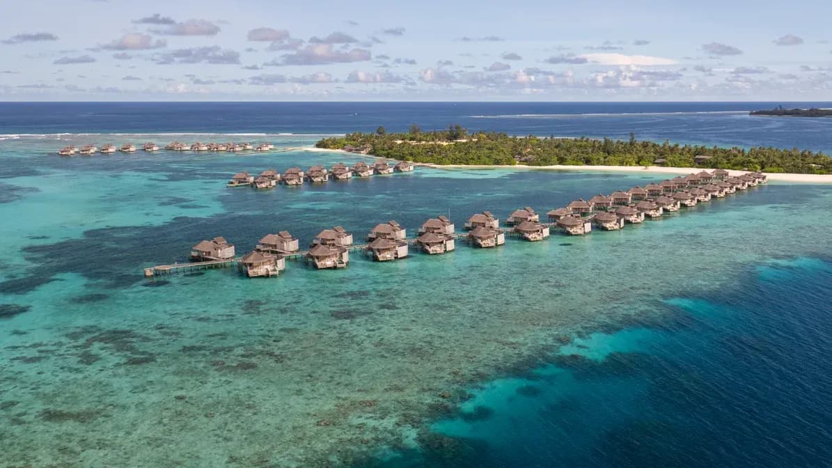 Aerial view of overwater villas along the jetty at Six Senses Laamu, Laamu Atoll, Maldives