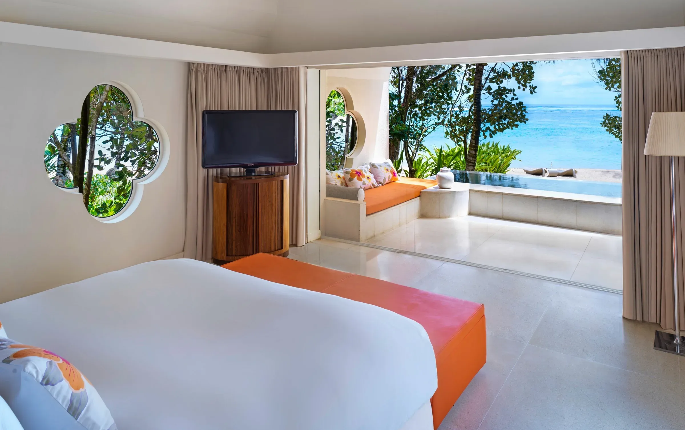 SO Beach Villa bedroom opening onto a private garden and plunge pool at SO Sofitel Mauritius