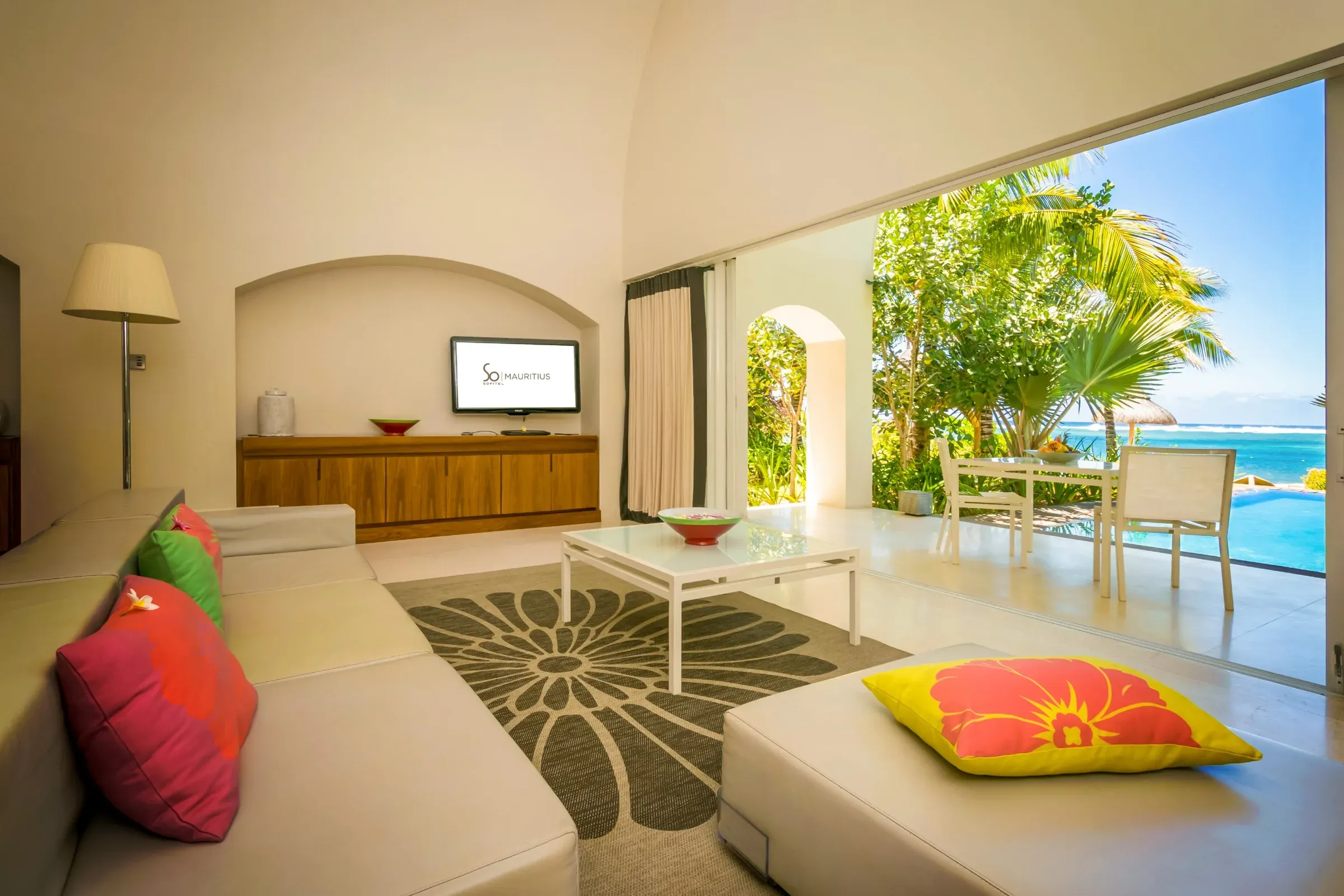 SO VIP Beach Villa living room with SO Mauritius branding and garden views at SO Sofitel Mauritius