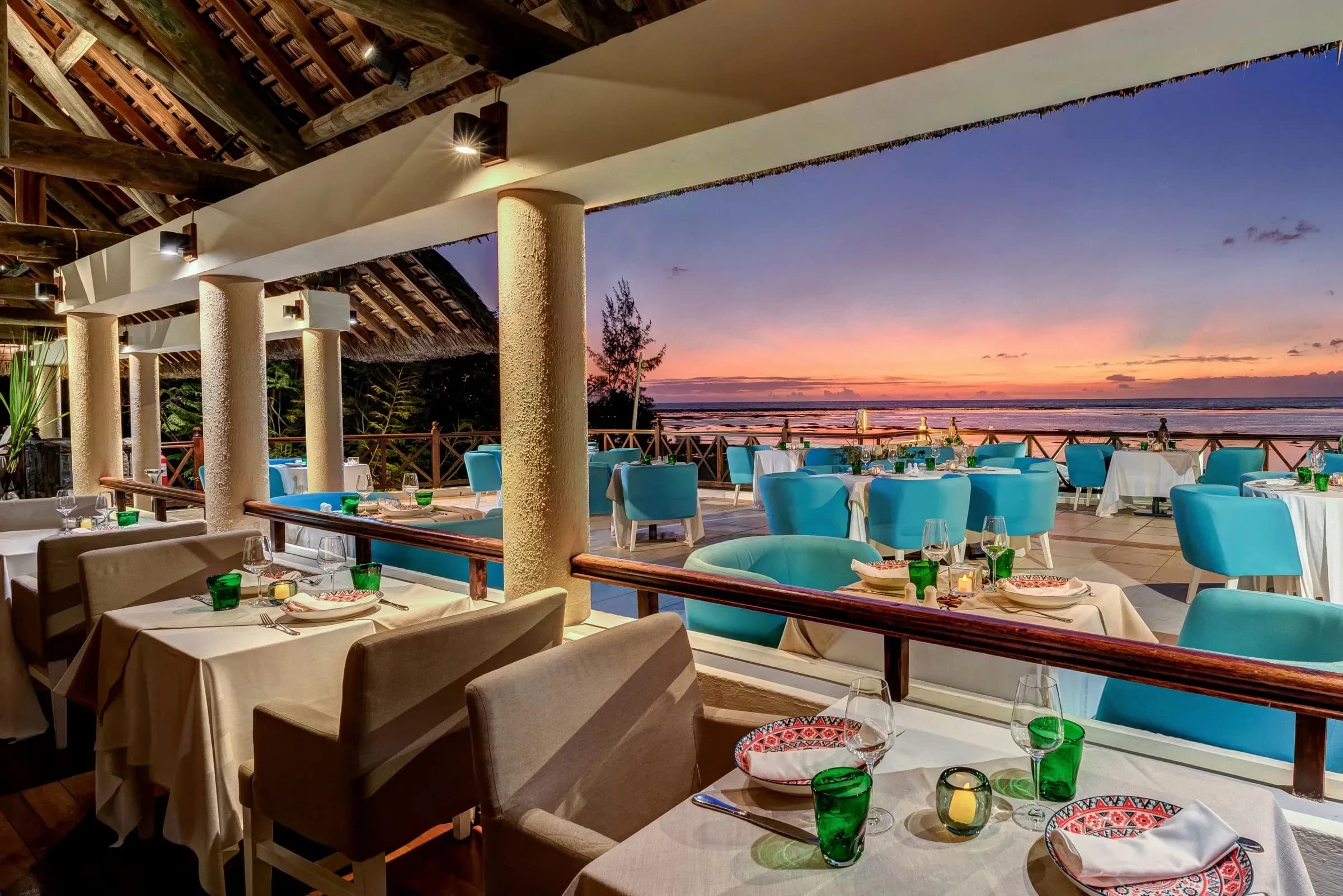 Jacaranda restaurant terrace at dusk overlooking the west coast sunset at Sofitel Mauritius L'Impérial Resort & Spa