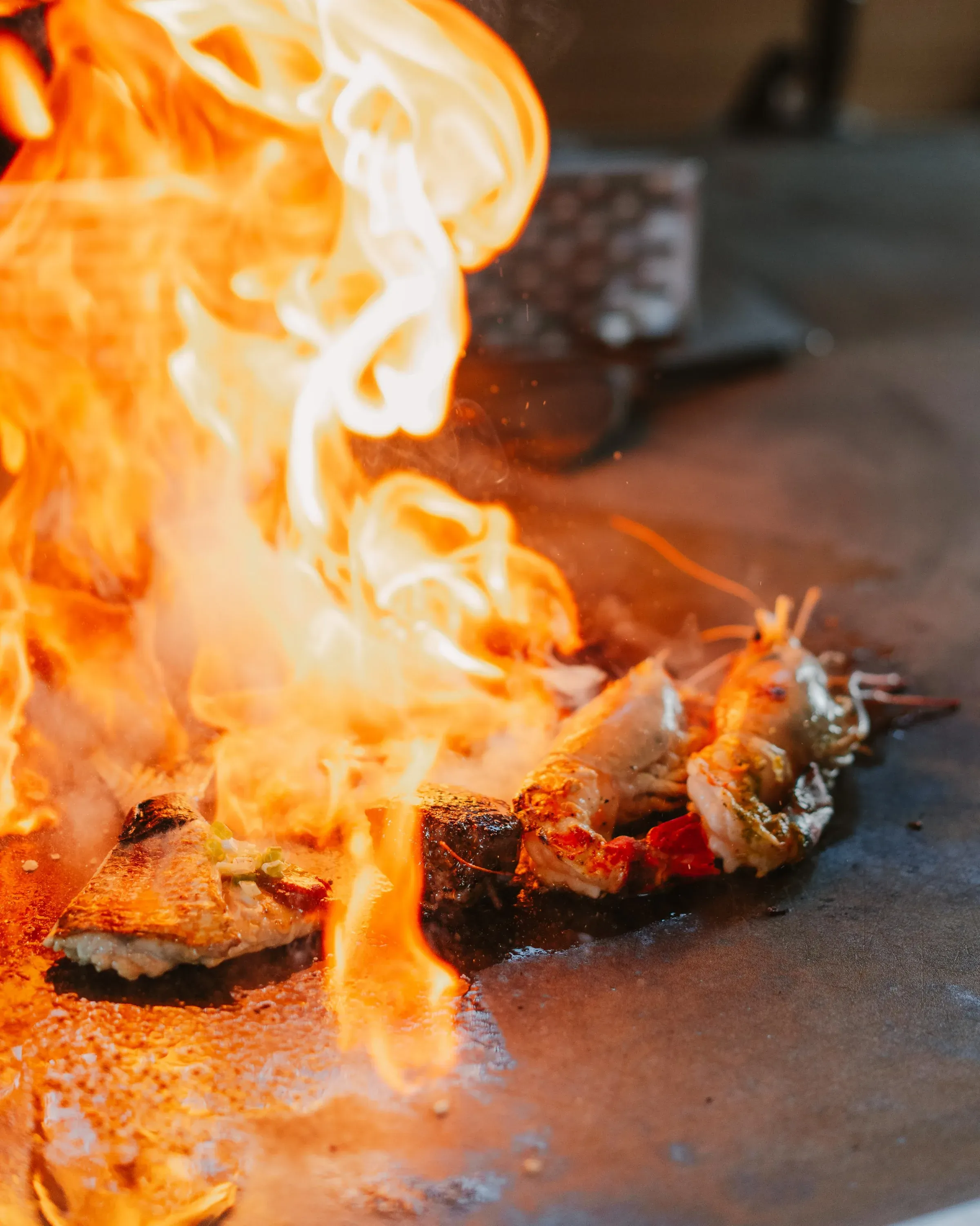Teppanyaki grill flambe over seafood and steak at Sofitel Mauritius L'Impérial Resort & Spa