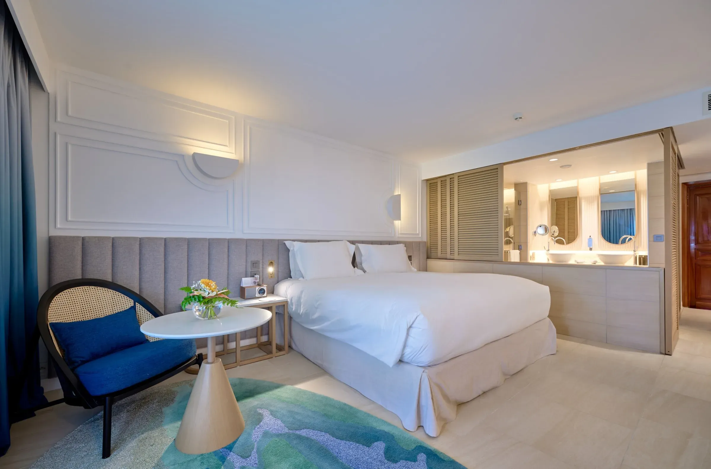 Luxury Room interior with king bed and open-plan bathroom at Sofitel Mauritius L'Impérial Resort & Spa