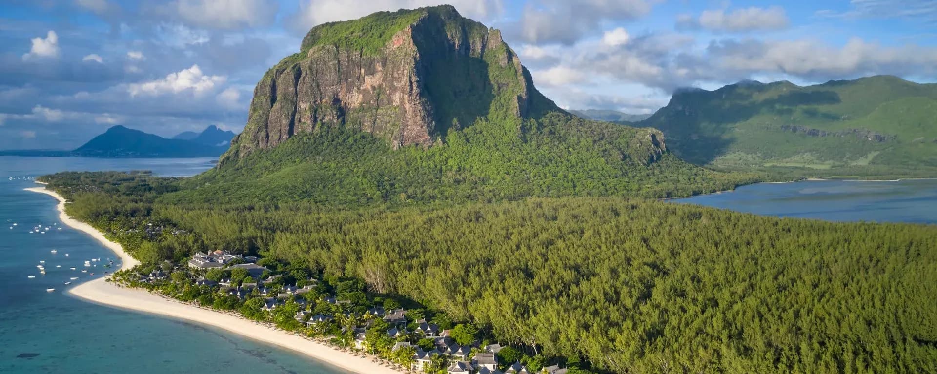 Aerial view of The St. Regis Le Morne Resort, Mauritius beneath Le Morne Brabant mountain, Le Morne peninsula, Mauritius