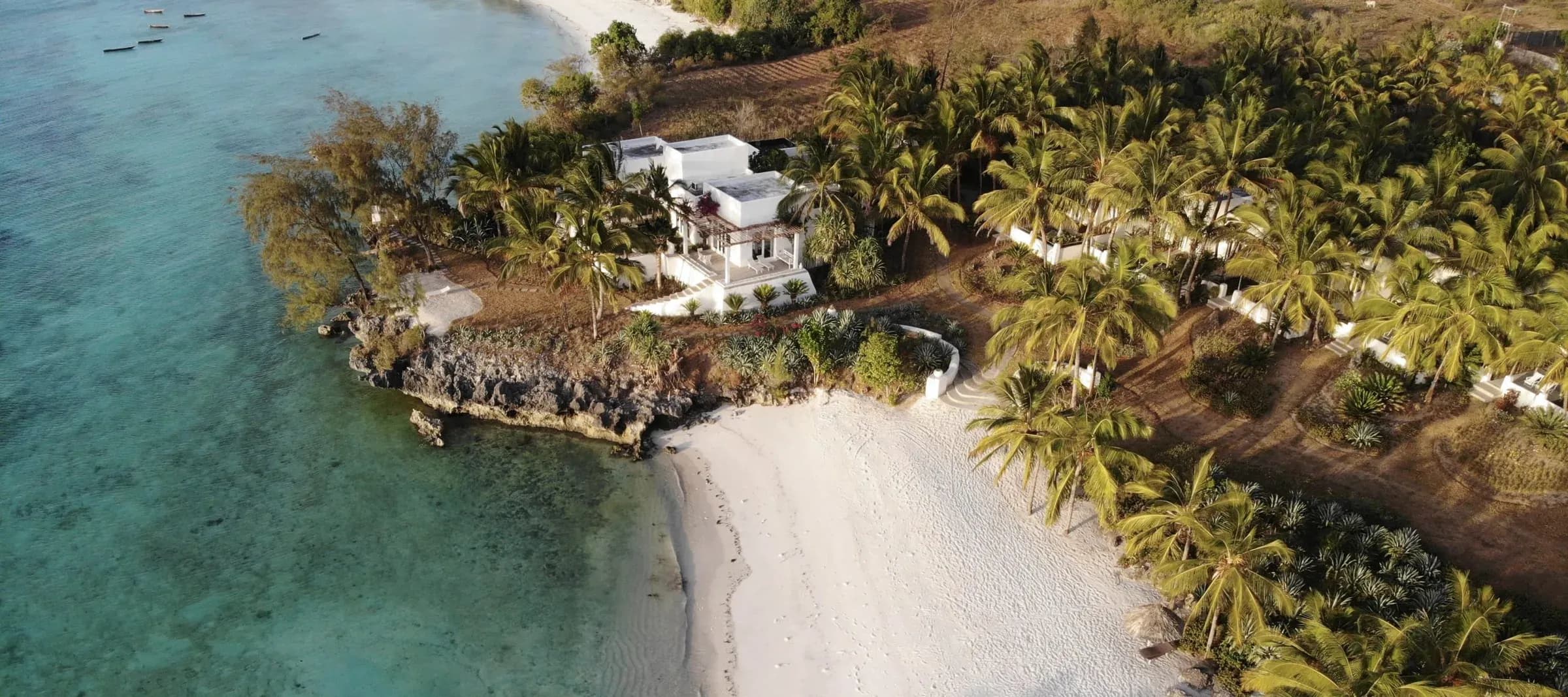 Aerial view of an oceanfront villa and gardens at The Aiyana, Pemba Island
