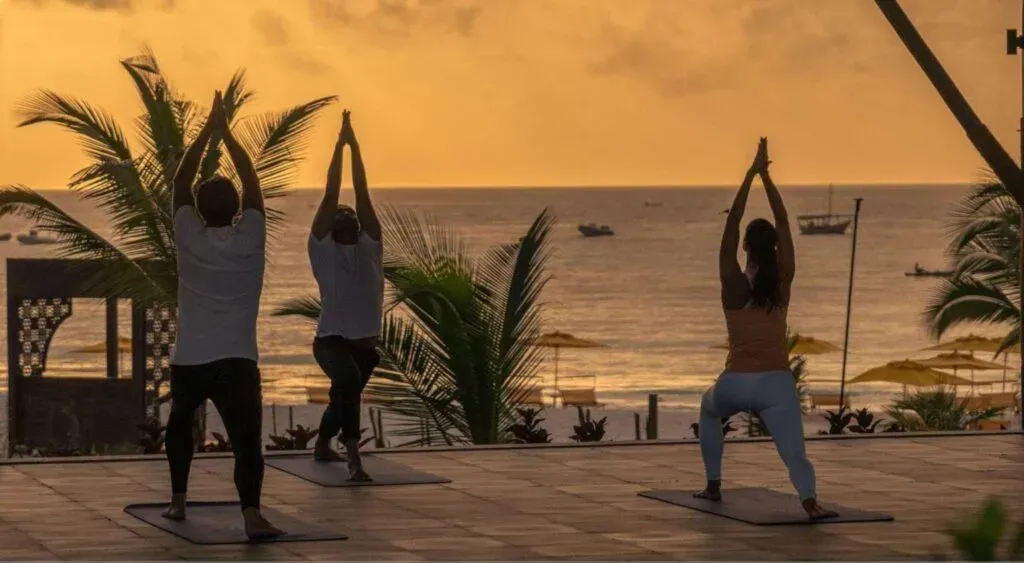 Sunrise yoga session on the terrace at The Mora Zanzibar's wellness centre