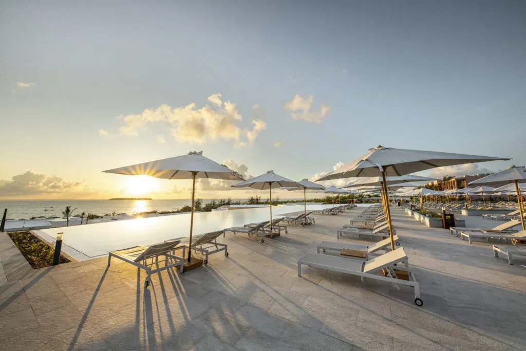 Aerial view of the infinity pool and ocean at The Mora Zanzibar, Muyuni Beach