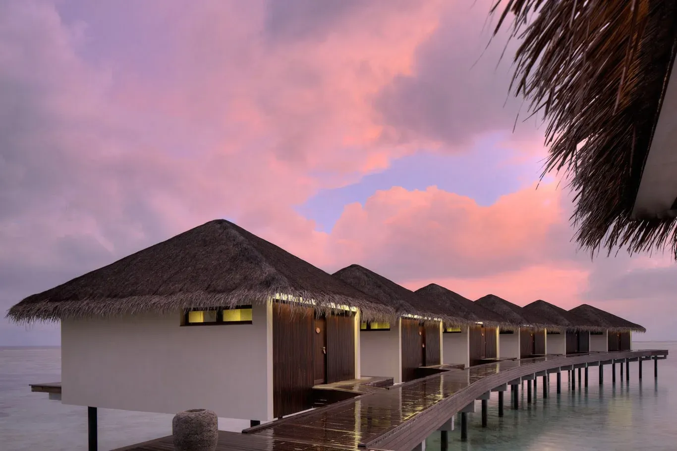 Overwater Spa by Clarins pavilions at sunset, The Residence Maldives at Falhumaafushi