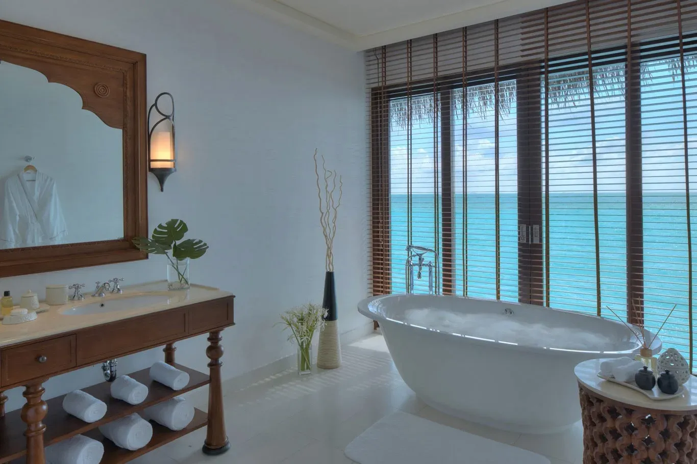Water Villa bathroom with freestanding tub and ocean view, The Residence Maldives at Falhumaafushi