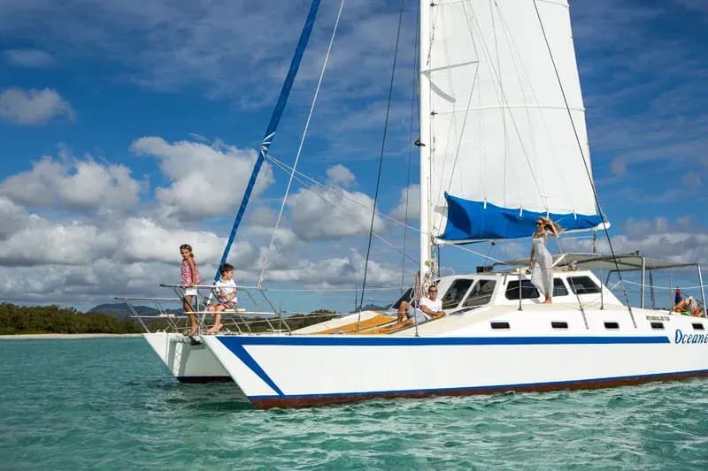 Catamaran sailing off the beach at The Residence Mauritius