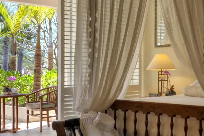 Colonial Ocean View Suite bedroom at The Residence Mauritius