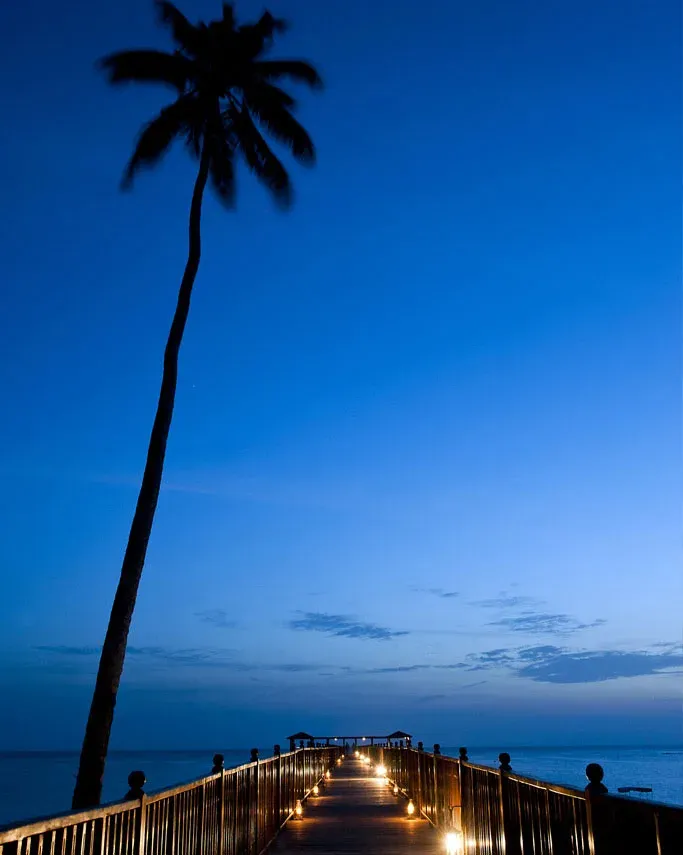 The Jetty lit at dusk over the Indian Ocean, The Residence Zanzibar