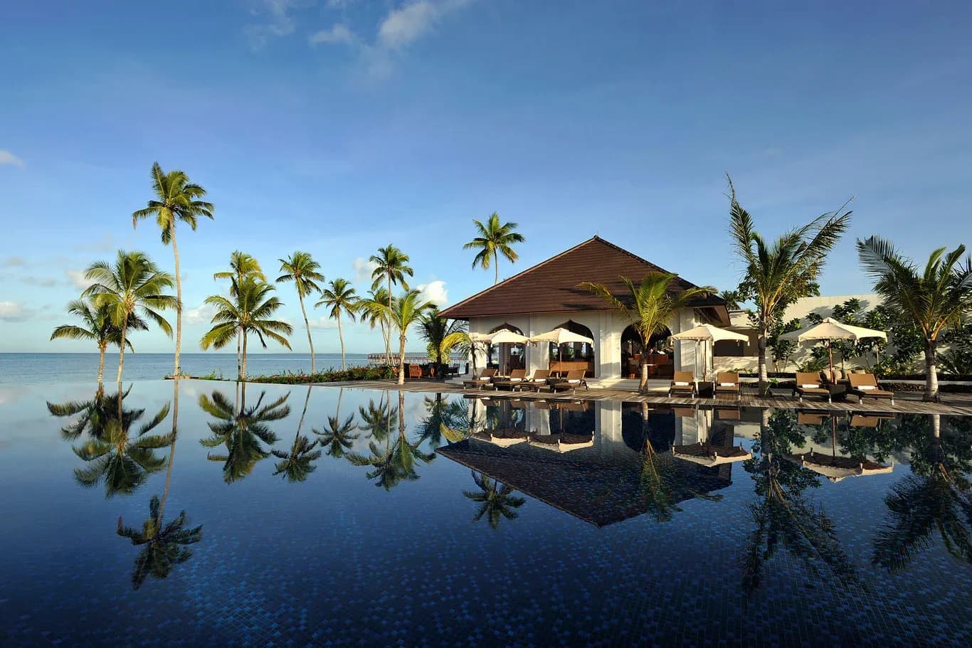 Beachfront infinity pool beside The Dining Room pavilion at The Residence Zanzibar
