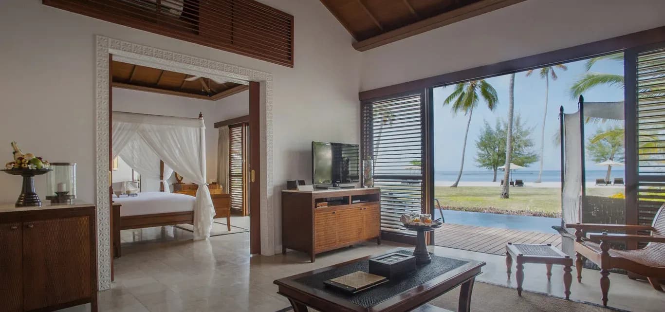 Frangipani Ocean Front Pool Villa exterior along the shore at The Residence Zanzibar