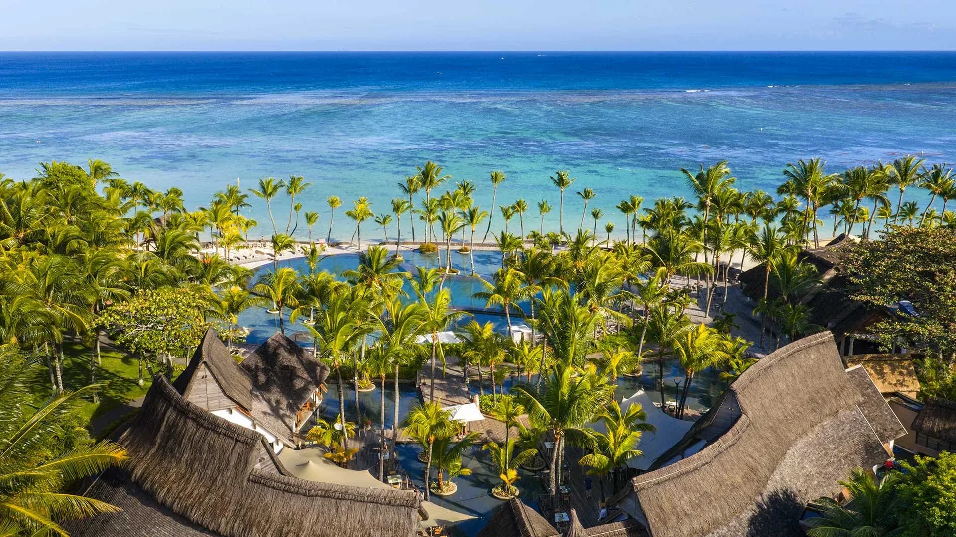 Beachfront gardens and pool area at Trou aux Biches Beachcomber Golf Resort & Spa