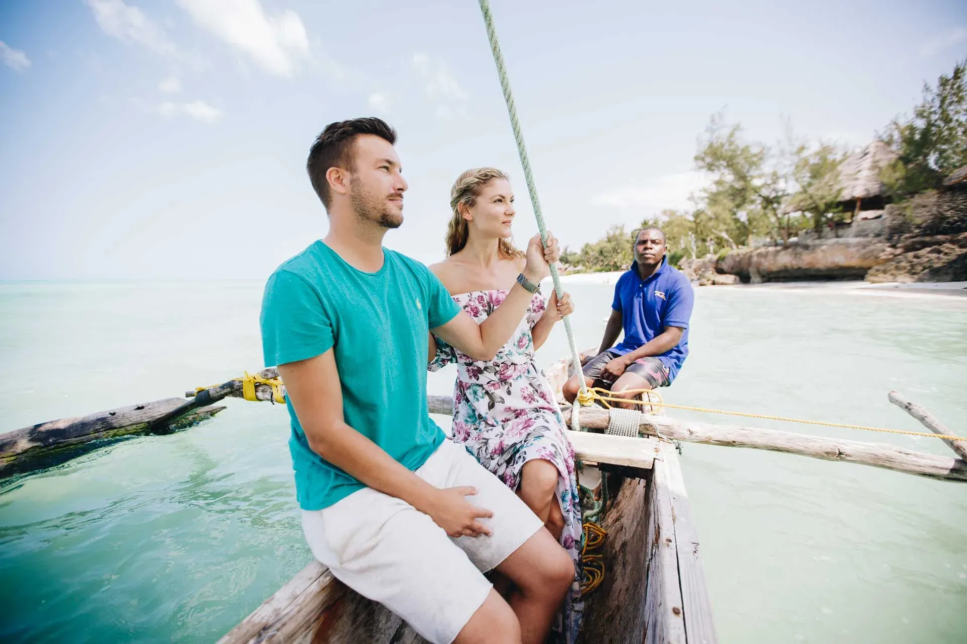 Traditional wooden ngalawa sailing boat off the beach at Tulia Zanzibar