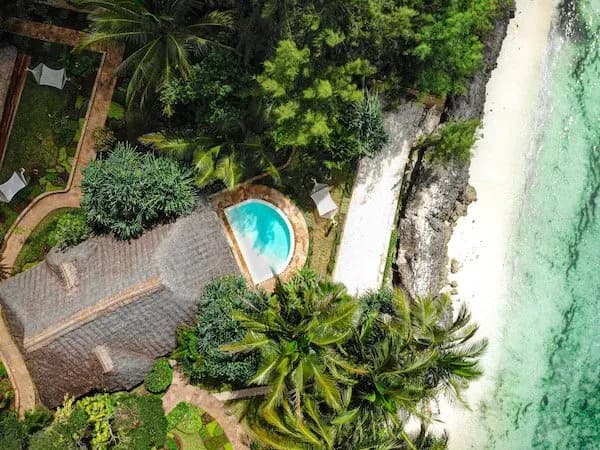 Aerial view of a Seafront Luxury Villa with Private Pool set on the cliff above the ocean at Tulia Zanzibar
