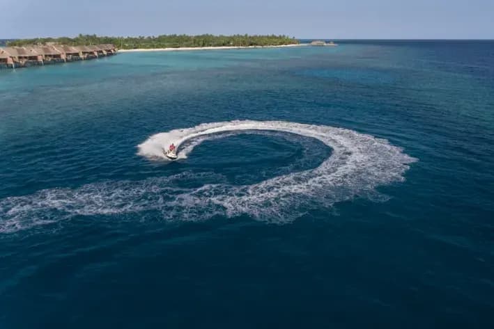Splash Dive and Watersports Centre boat over the reef at Vakkaru Maldives
