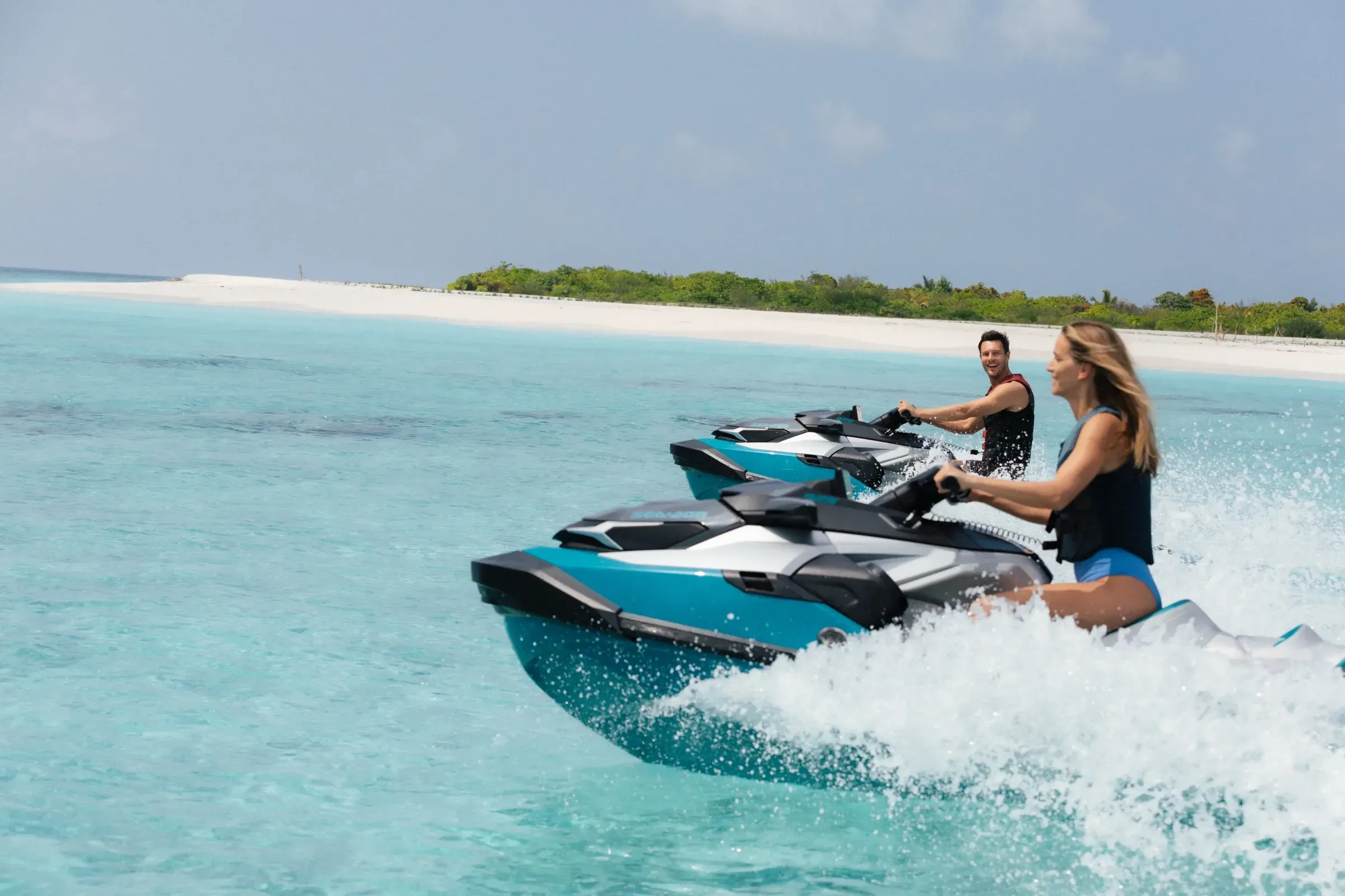 Guests riding jet skis in the lagoon at Velaa Private Island