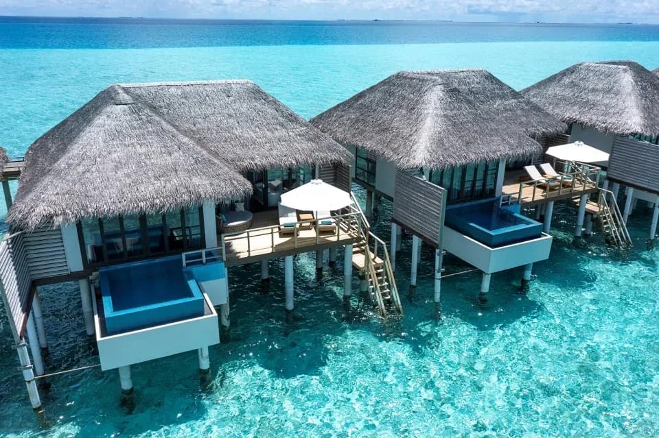 Water Villa with Pool aerial view of the private plunge pool over the lagoon at Niva Velassaru Maldives