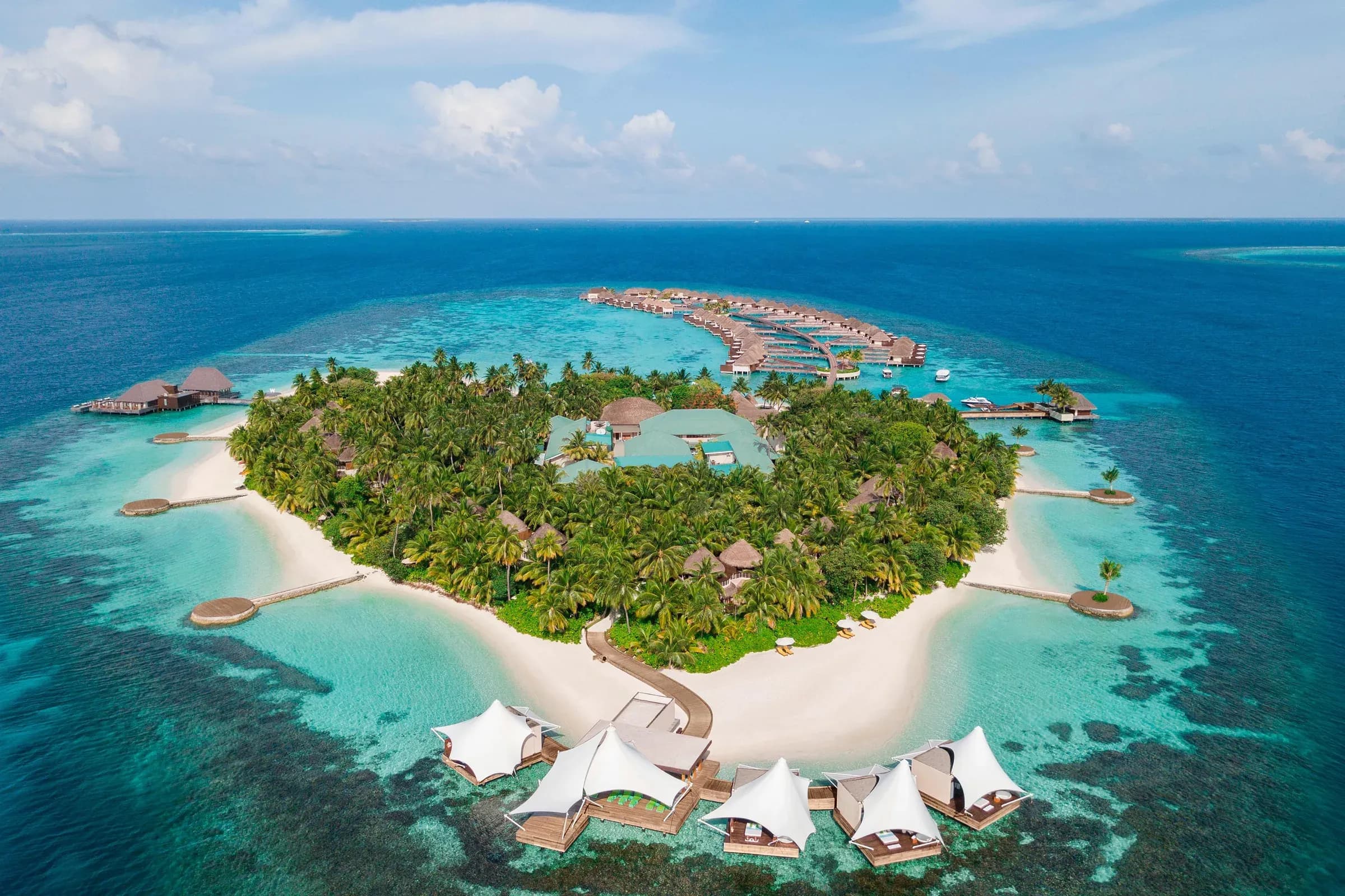 Aerial view of W Maldives island resort surrounded by turquoise lagoon