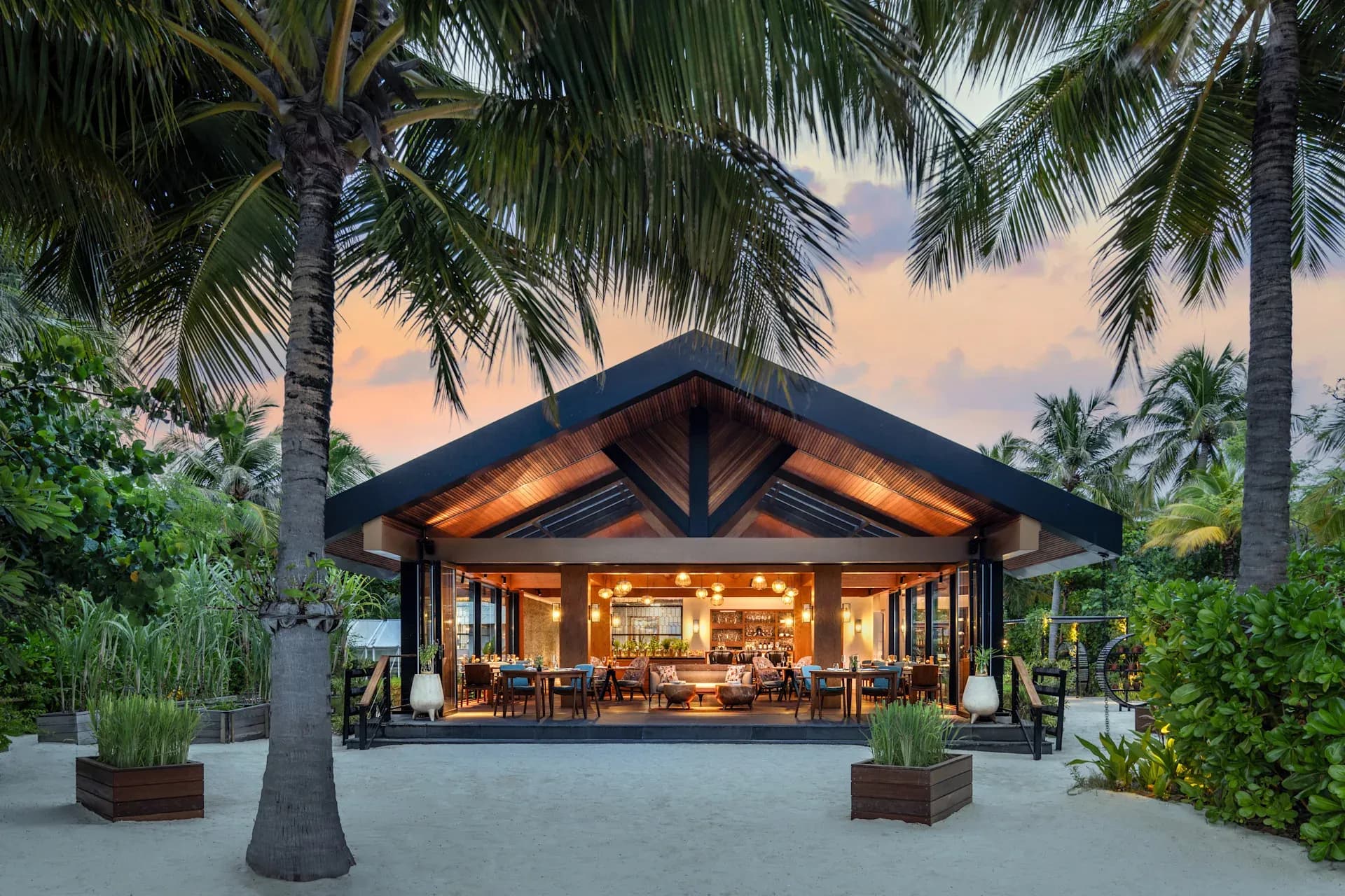 Dining setting at Glow, the Mediterranean restaurant at Waldorf Astoria Maldives Ithaafushi