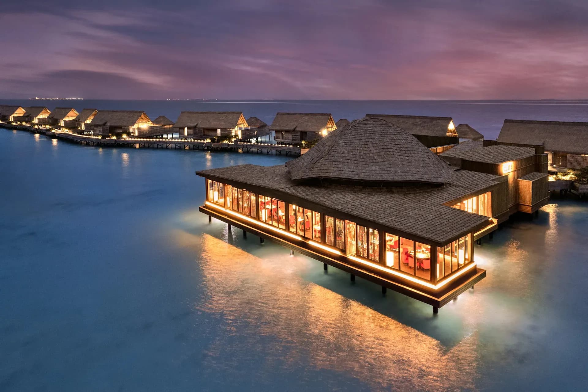 Zuma restaurant over the water at sunset, Waldorf Astoria Maldives Ithaafushi