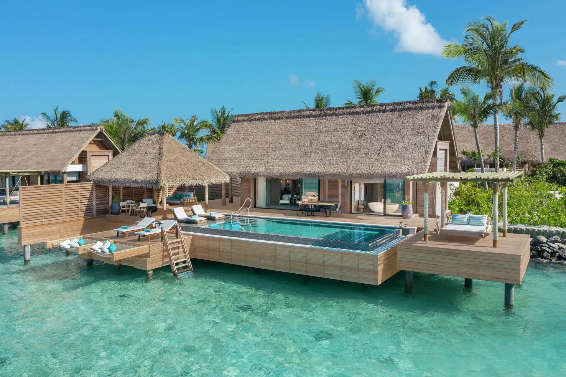 Exterior of a King Reef Villa with infinity pool at Waldorf Astoria Maldives Ithaafushi