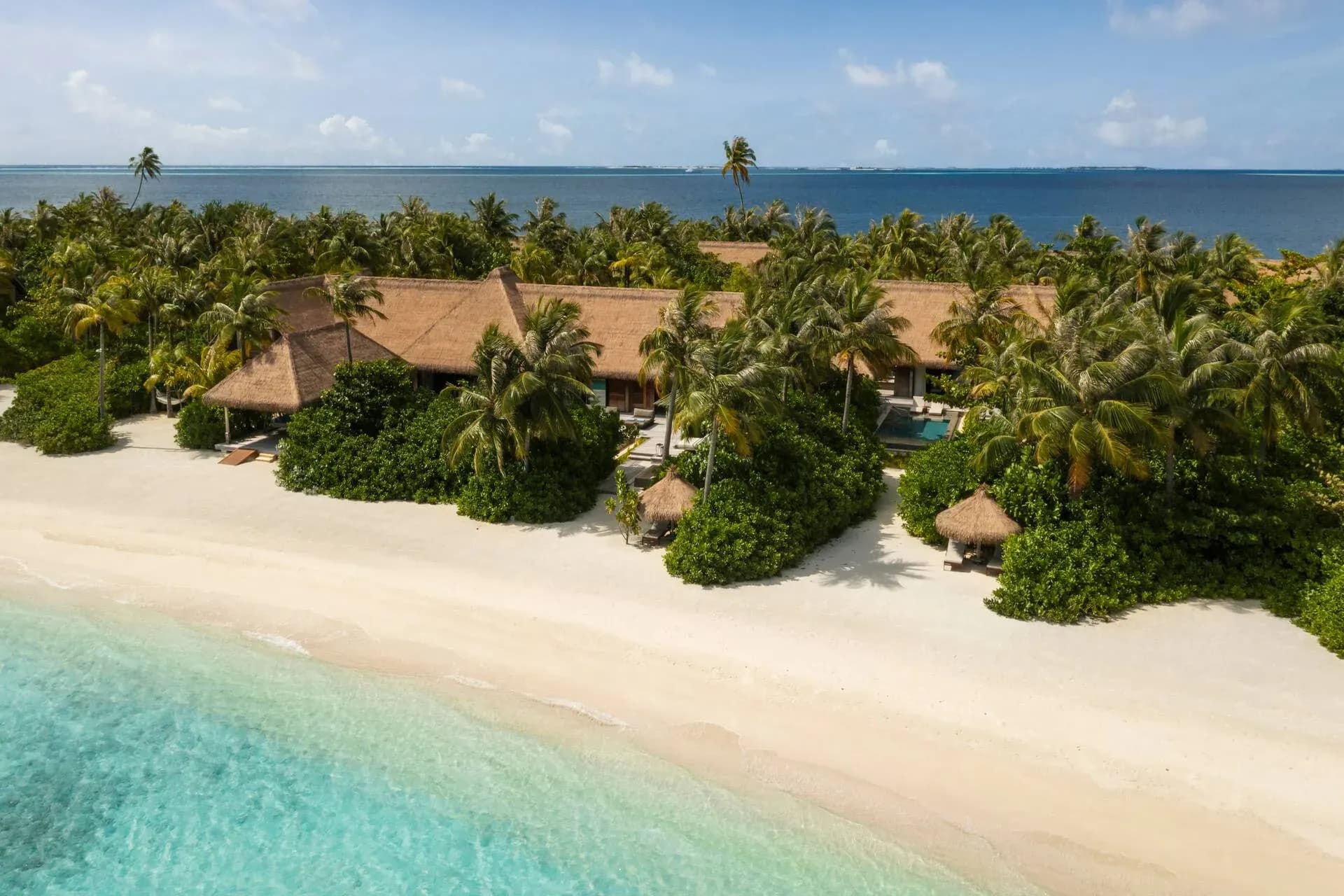 Aerial view of a Three Bedroom Grand Beach Villa with garden and pool at Waldorf Astoria Maldives Ithaafushi