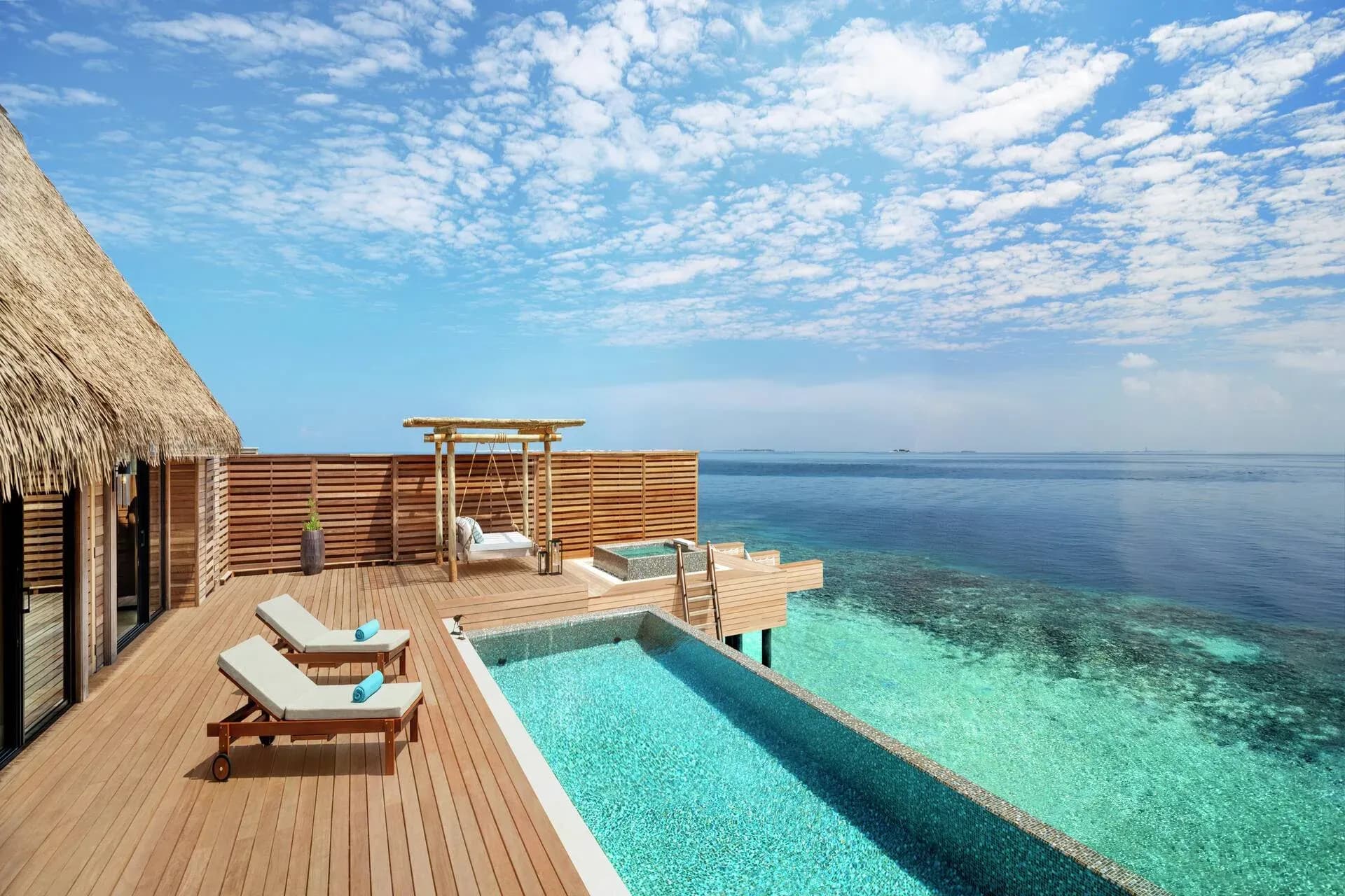 Terrace of a Three Bedroom Overwater Villa at Waldorf Astoria Maldives Ithaafushi