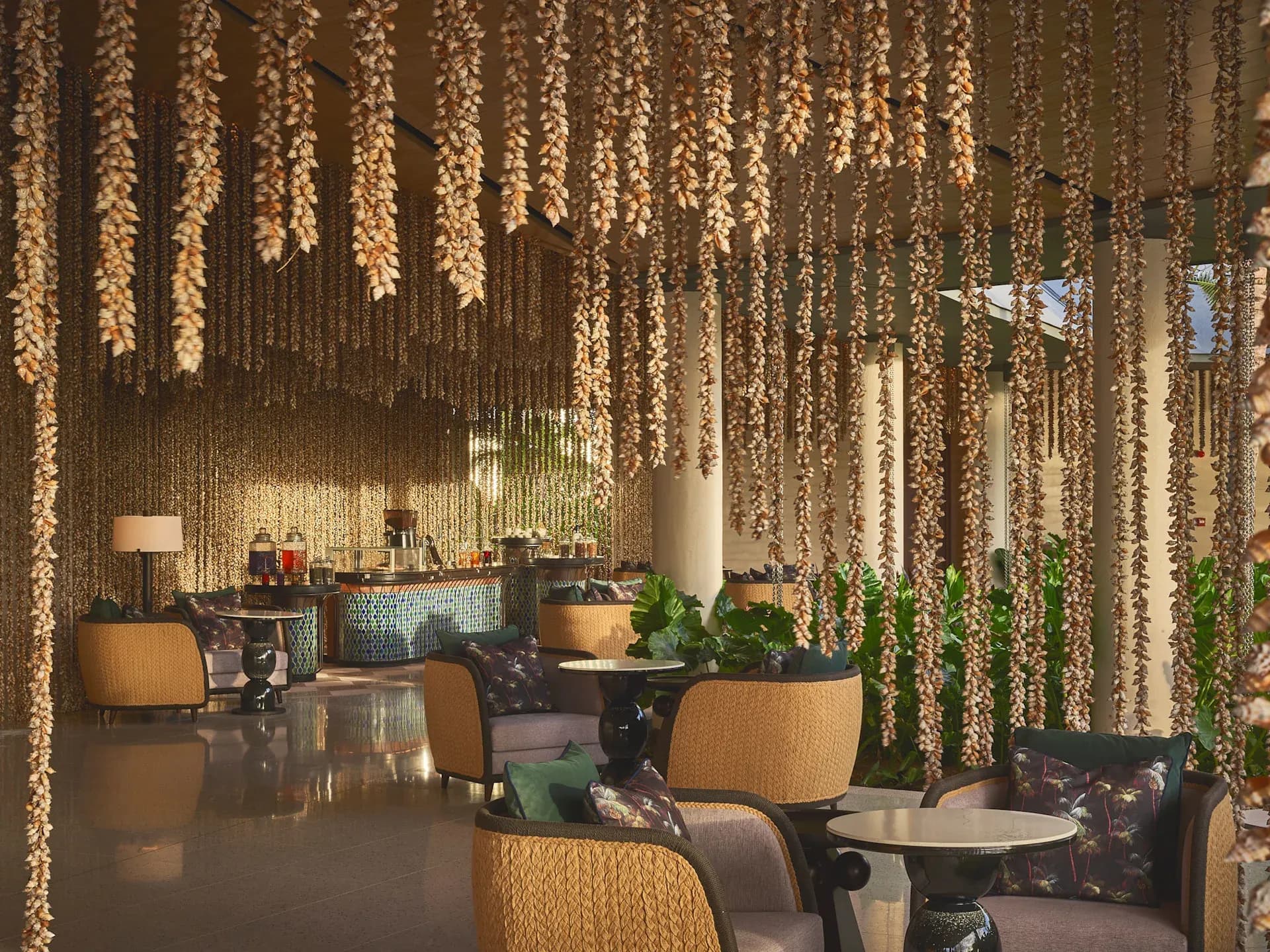 Peacock Terrace coffee and tea lounge seating beneath hanging vines