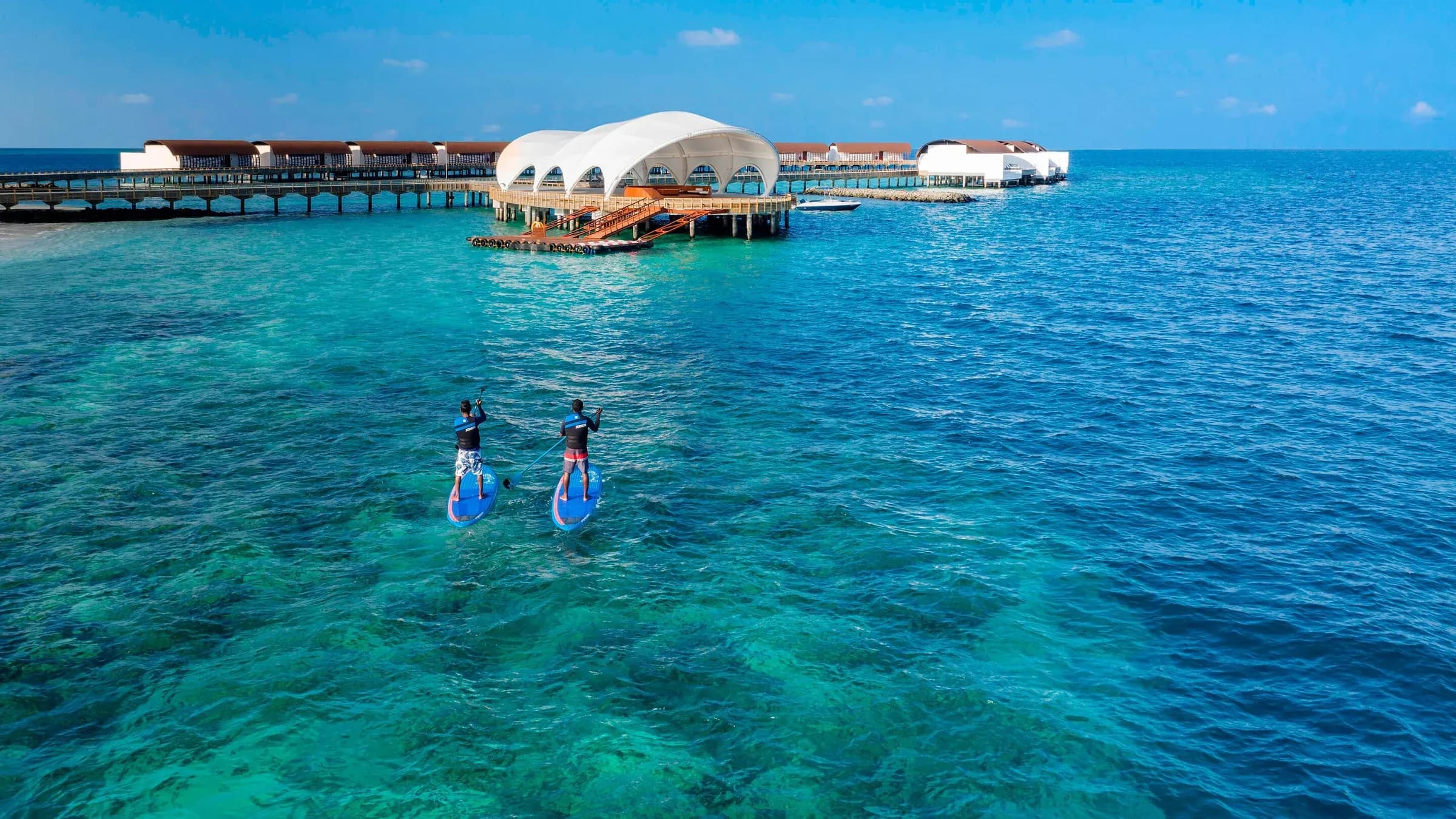 Paddle boarding at the watersports centre, The Westin Maldives Miriandhoo Resort