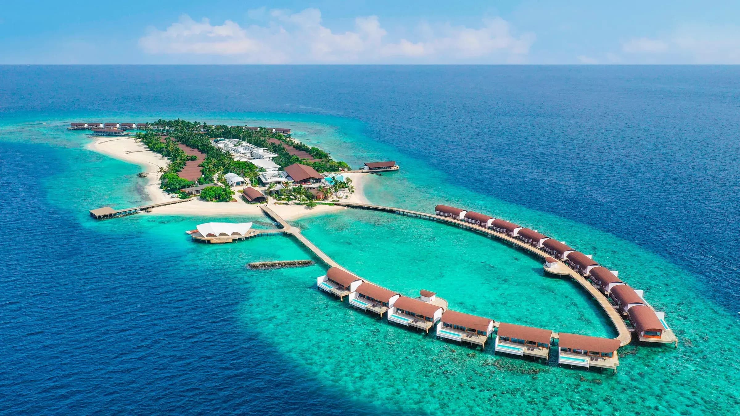 Aerial view of The Westin Maldives Miriandhoo Resort on Miriandhoo Island, Baa Atoll, showing beach and overwater villas