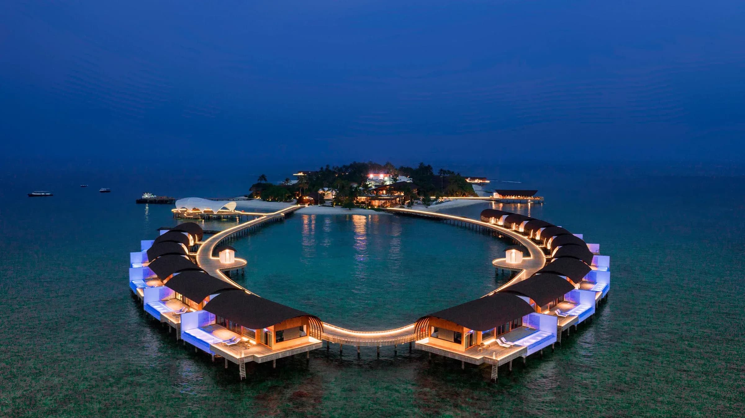 Aerial view of the reef and lagoon surrounding The Westin Maldives Miriandhoo Resort, Baa Atoll