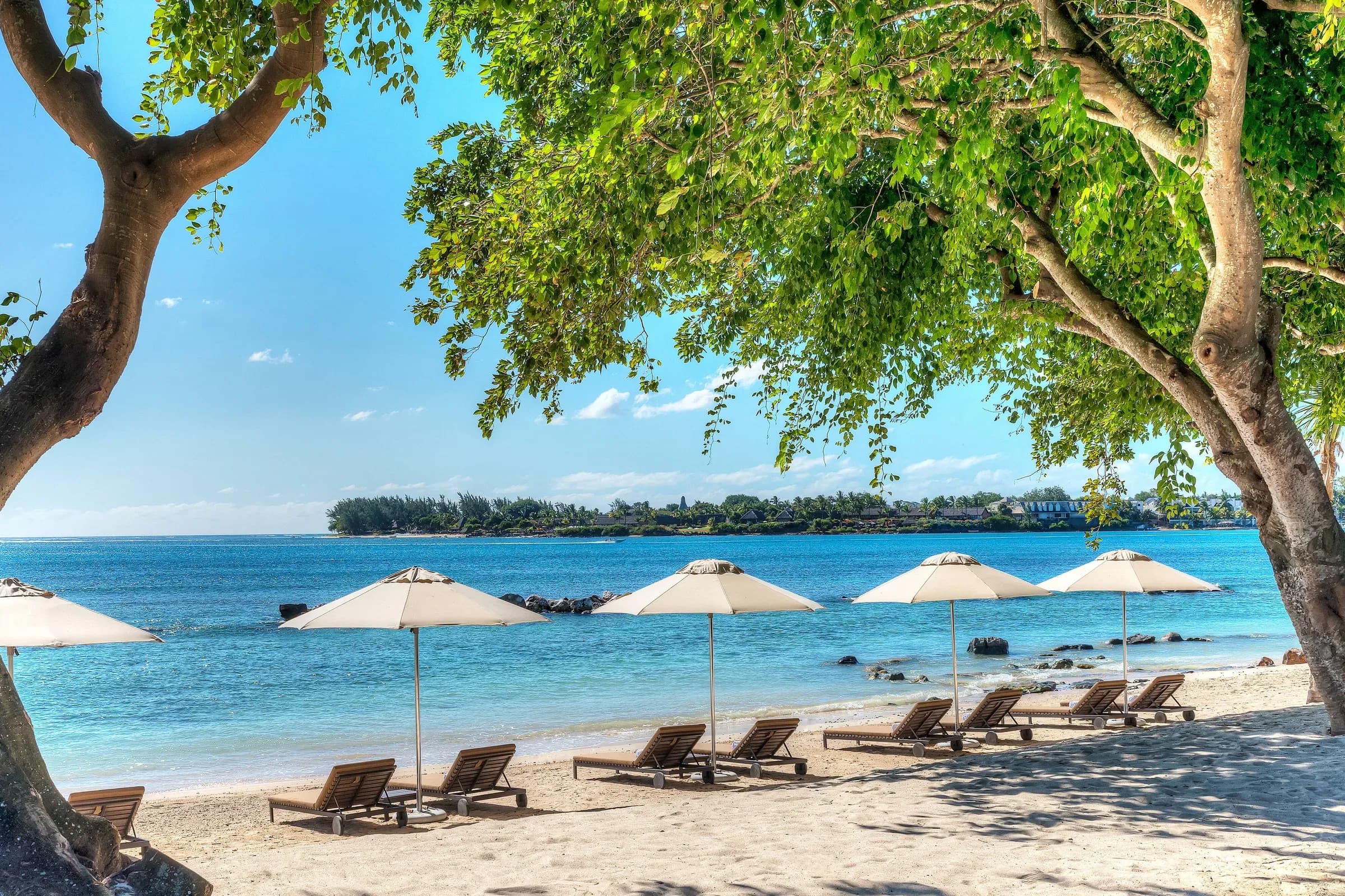 Beach loungers and umbrellas on Turtle Bay at The Westin Turtle Bay Resort & Spa, Mauritius
