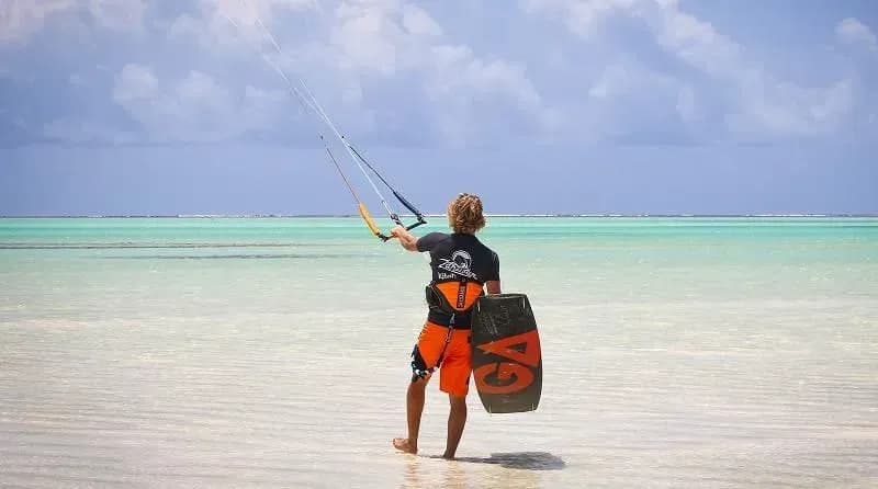 Kitesurfer on Paje's flat-water lagoon at the on-site IKO-certified Kitesurfing Center
