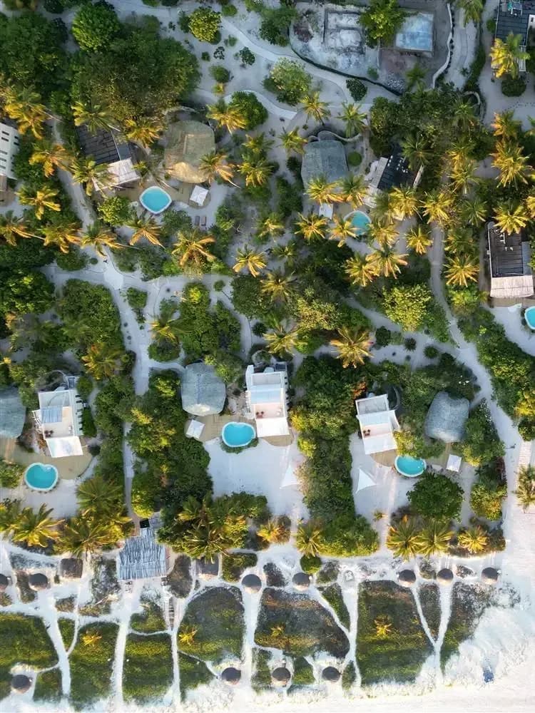 Aerial view of the private pool villas and gardens at Zanzibar White Sand, Paje