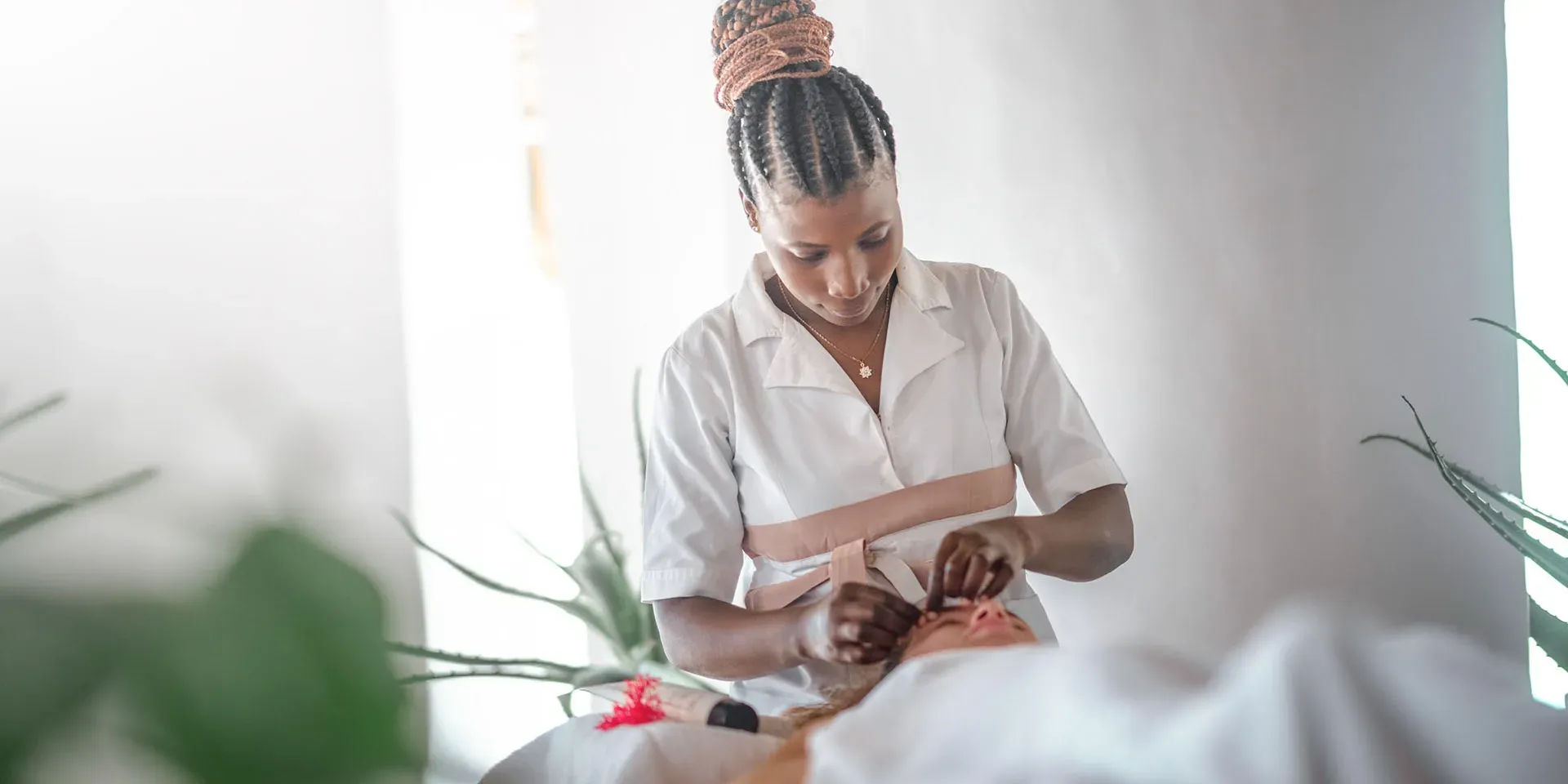 Therapist giving a treatment at Kiota Spa, Xanadu Luxury Villas, Zanzibar