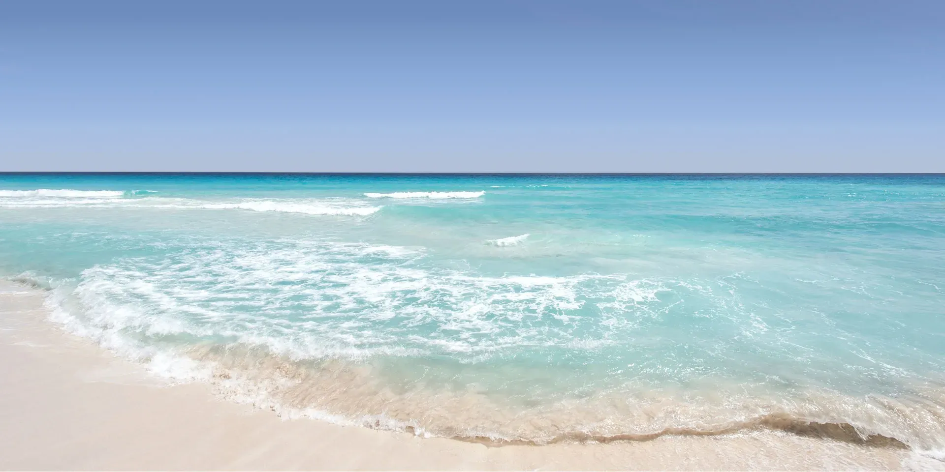 White sand beach and turquoise waves at Xanadu Luxury Villas, Zanzibar