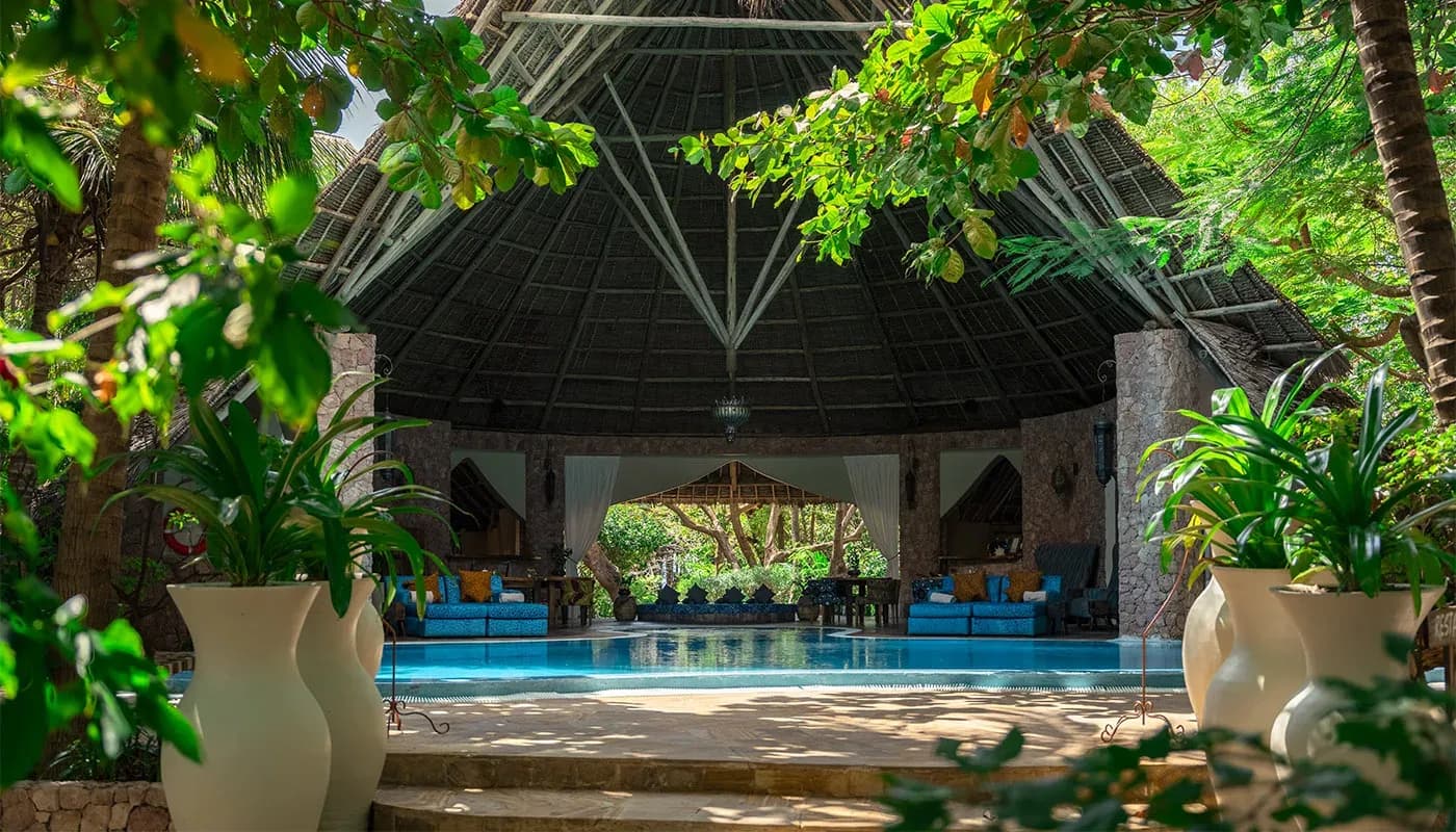 Ganda restaurant's thatched Makuti roof over the pool at Xanadu Luxury Villas, Zanzibar