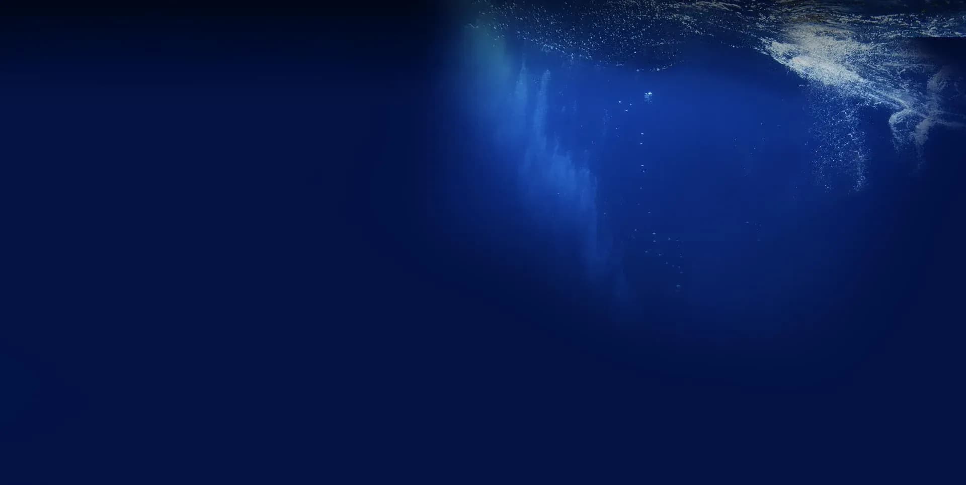 Diver beneath the waves with Rising Sun Dive Centre near Zawadi Hotel Zanzibar